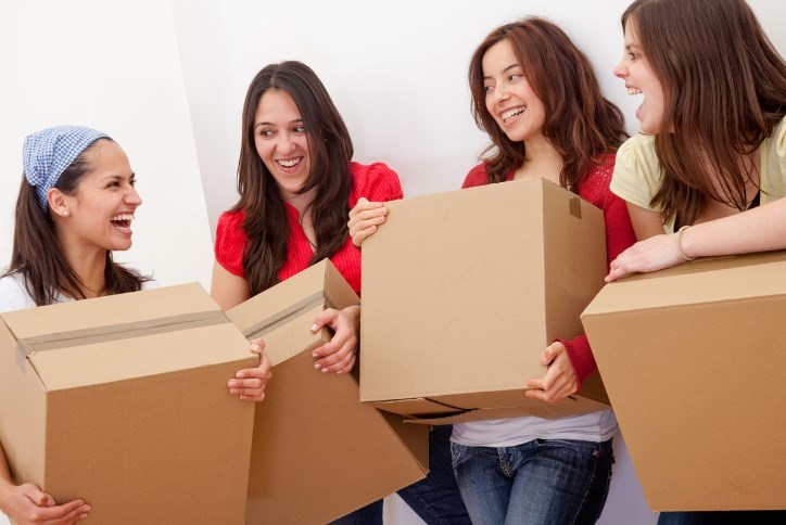 Girls moving boxes at Sterling on the Lake