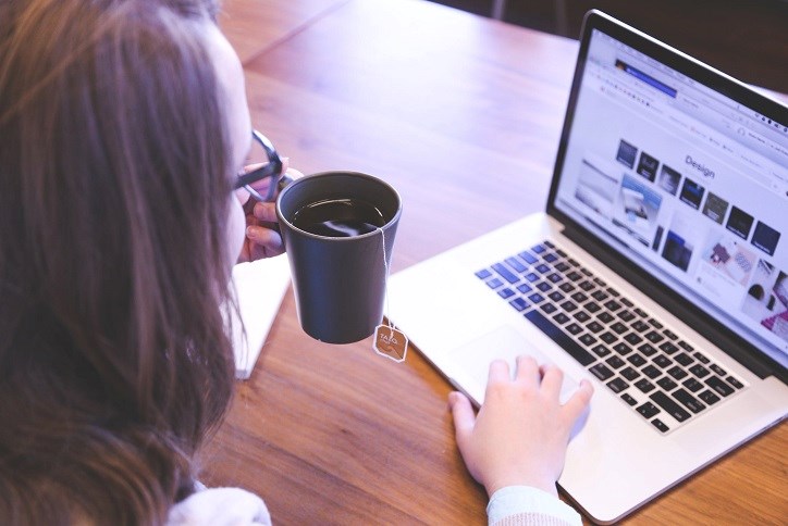 Woman on laptop working from home.